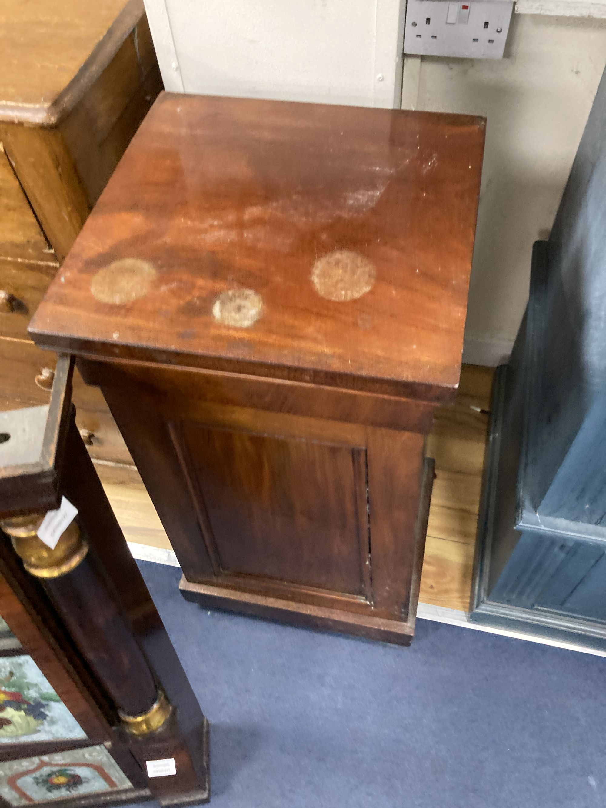 A 19th century American simulated rosewood wall clock, height 84cm, a 19th century inlaid wall clock and a mahogany pedestal cupboard